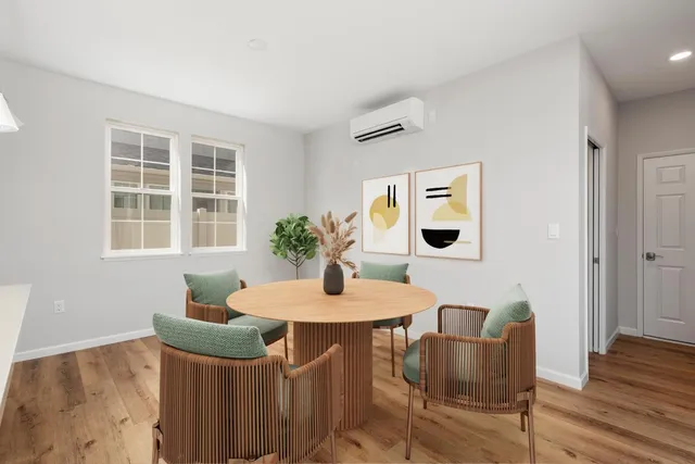 a dining room with furniture and window