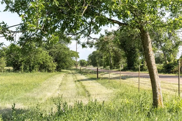 a view of a swimming pool with an outdoor space and seating area