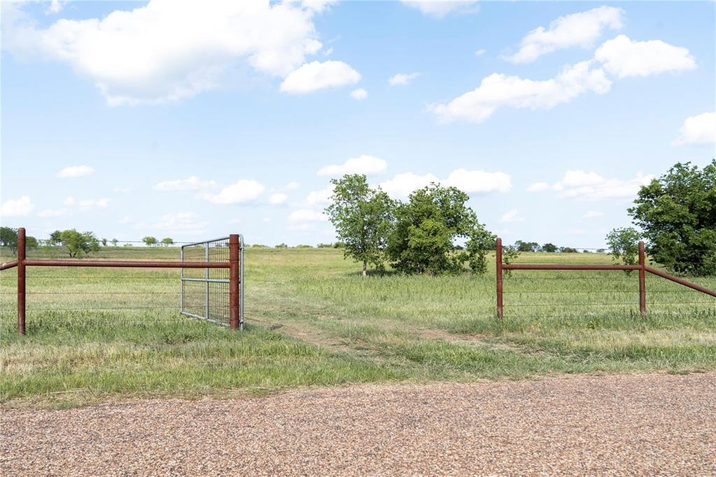 Tbd Rattler Hill Road McGregor, TX 76657 - Photo 3 of 18 a view of a lake from a yard