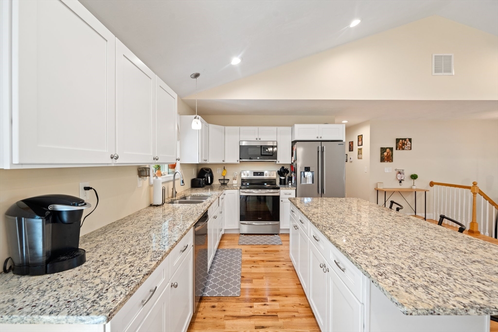 190 Lower Gore Road Webster, MA 01570 - Photo 18 of 41 a large kitchen with stainless steel appliances granite countertop a counter top and a stove