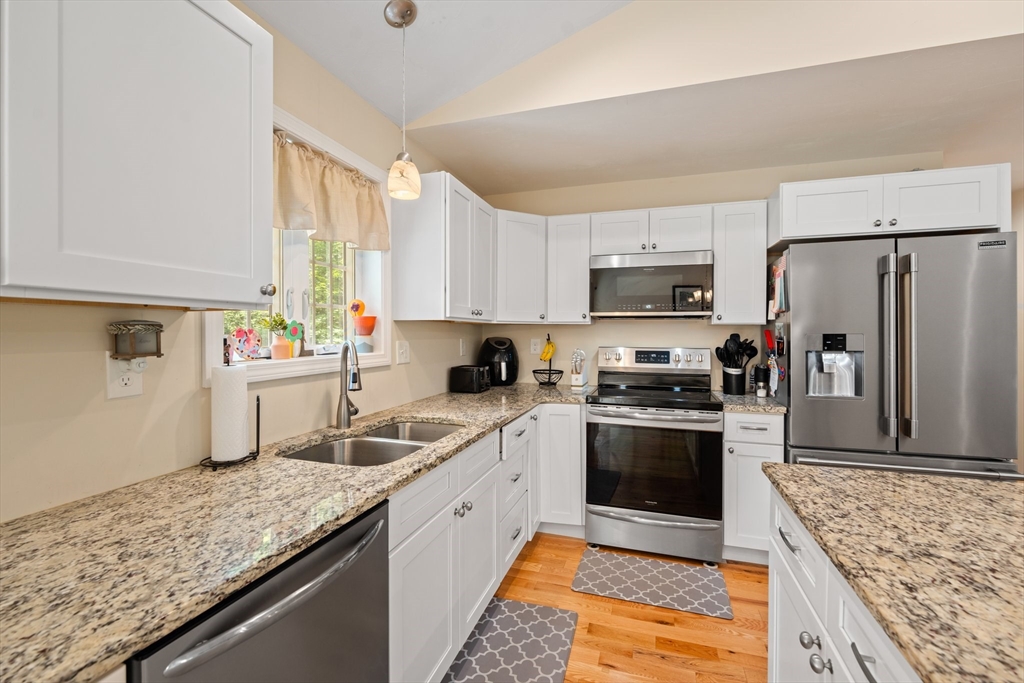 190 Lower Gore Road Webster, MA 01570 - Photo 19 of 41 a kitchen with stainless steel appliances granite countertop a sink stove and refrigerator