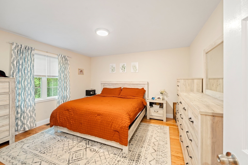 190 Lower Gore Road Webster, MA 01570 - Photo 23 of 41 a bed sitting in a bedroom next to a window