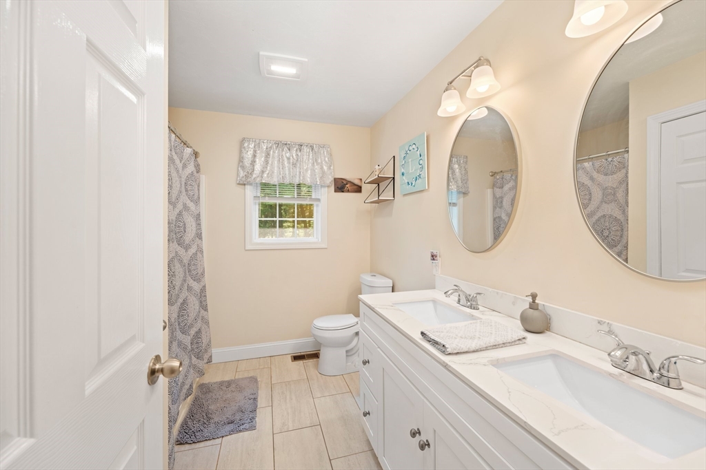 190 Lower Gore Road Webster, MA 01570 - Photo 29 of 41 a bathroom with a double vanity sink mirror and