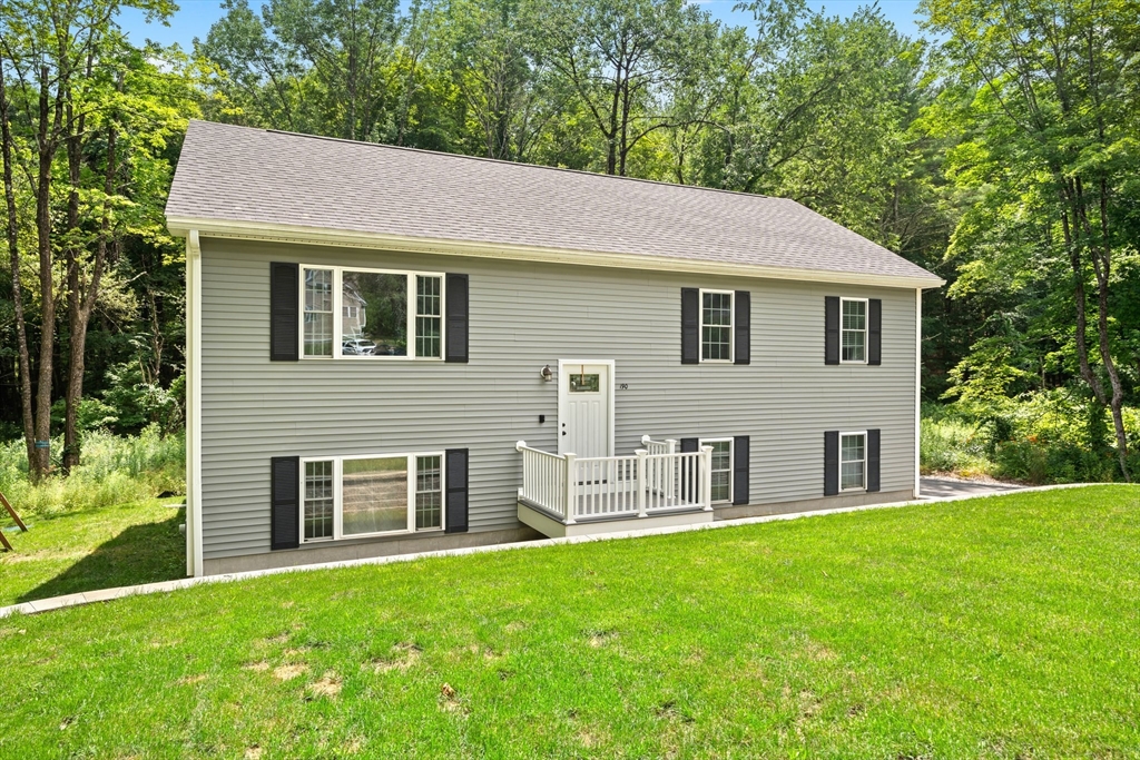 190 Lower Gore Road Webster, MA 01570 - Photo 3 of 41 a front view of house with yard and green space