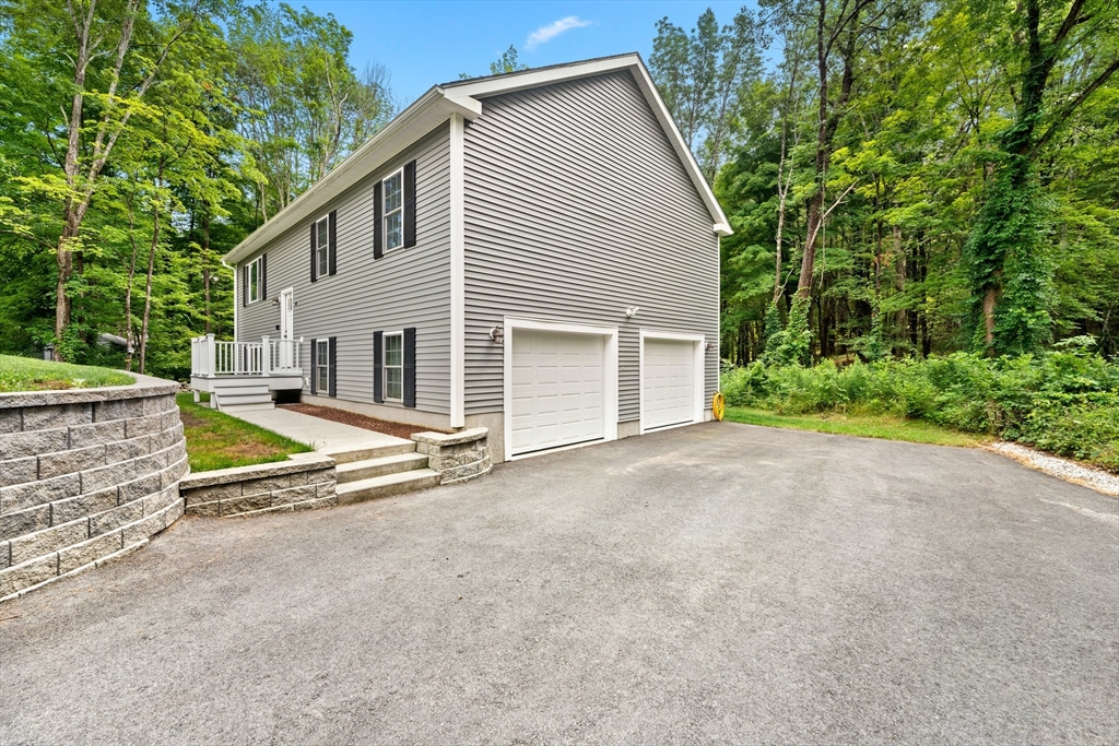 190 Lower Gore Road Webster, MA 01570 - Photo 6 of 41 a view of a house with backyard and trees