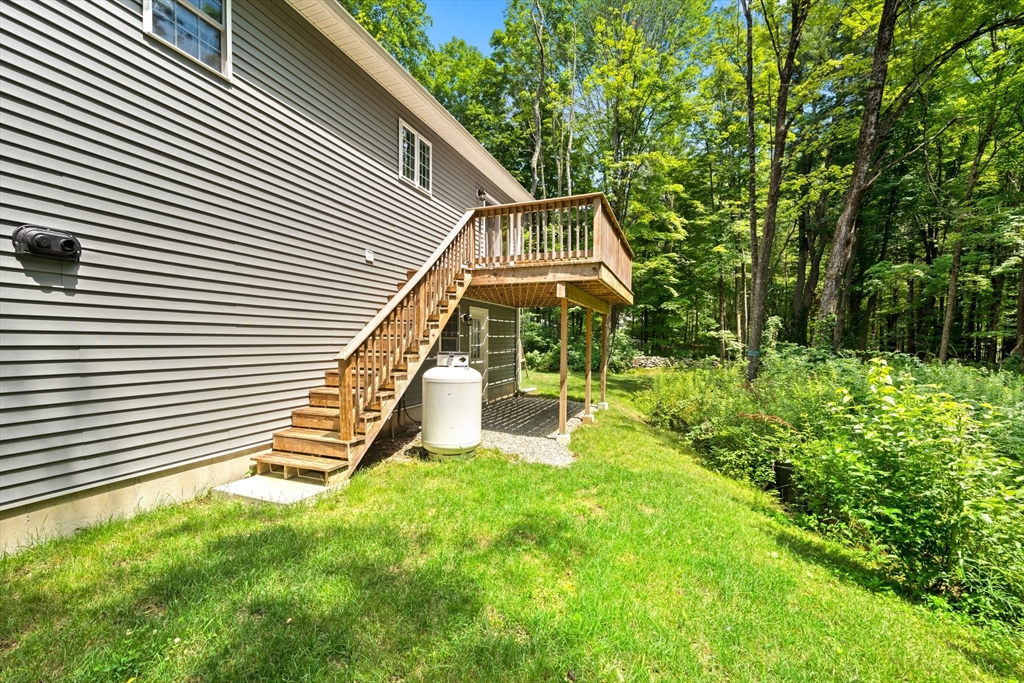 190 Lower Gore Road Webster, MA 01570 - Photo 8 of 41 a front view of a house with a yard