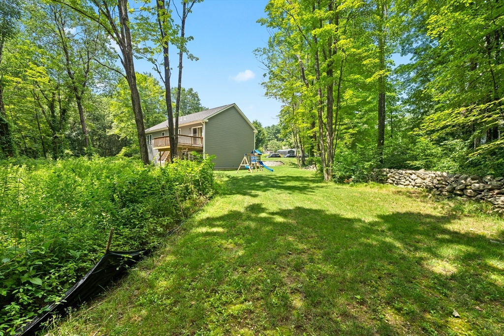 190 Lower Gore Road Webster, MA 01570 - Photo 9 of 41 a backyard of a house with lots of green space
