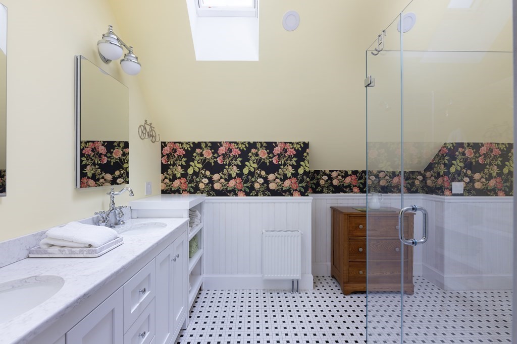 175 Mt Vernon Street Newton, MA 02465 - Photo 17 of 21 a bathroom with a sink and a mirror