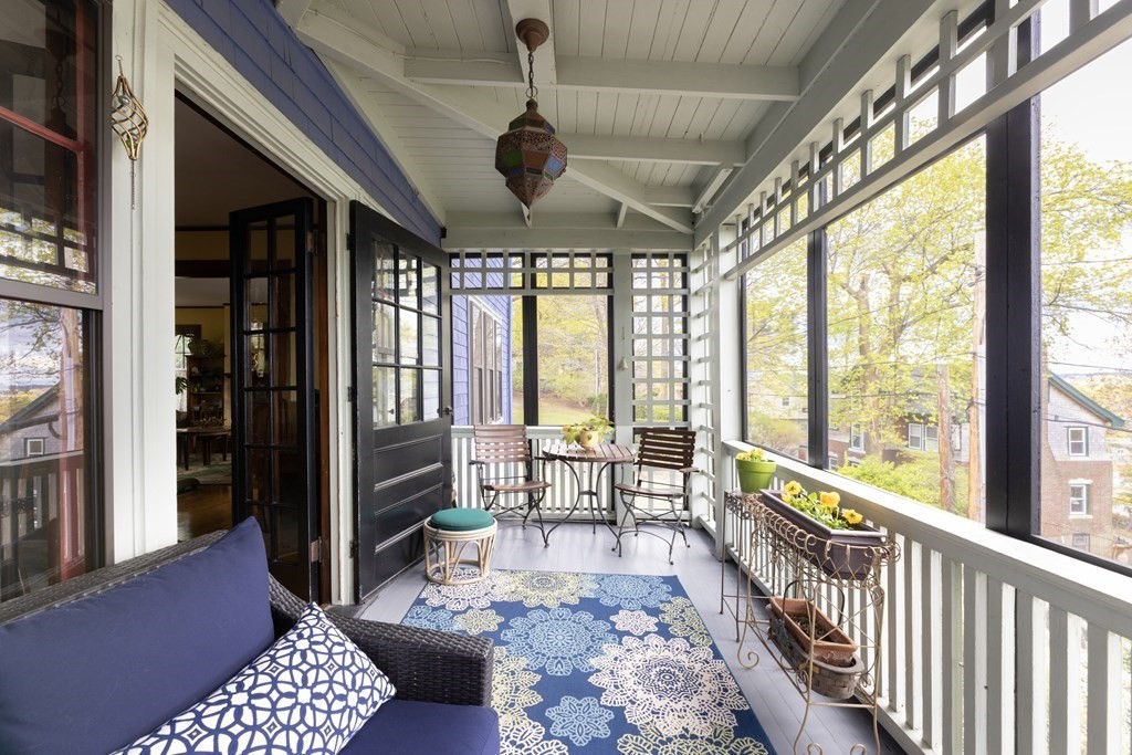 175 Mt Vernon Street Newton, MA 02465 - Photo 5 of 21 a living room with furniture and a large window