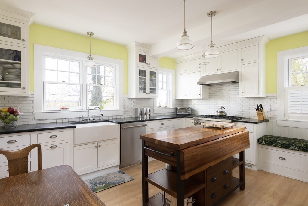175 Mt Vernon Street Newton, MA 02465 - Photo 8 of 21 a kitchen with stainless steel appliances granite countertop a stove a sink and a refrigerator