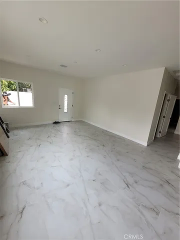 a view of a room with window and a fireplace