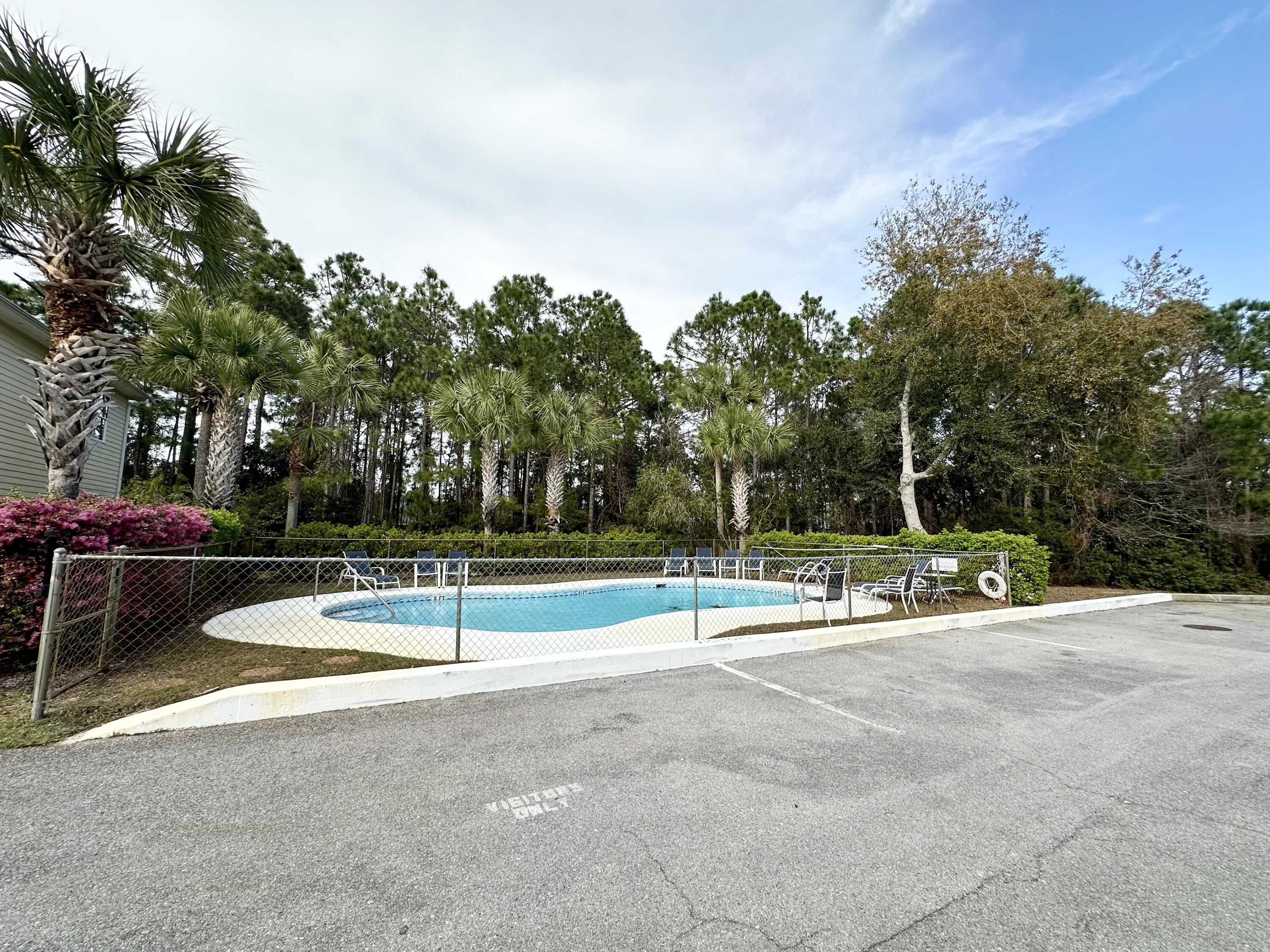 732 East Mack Bayou Drive, Unit 2 Santa Rosa Beach, FL 32459 - Photo 41 of 43 a view of a playground with basketball court