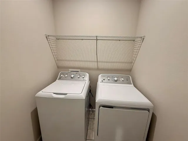 a utility room with dryer and washer