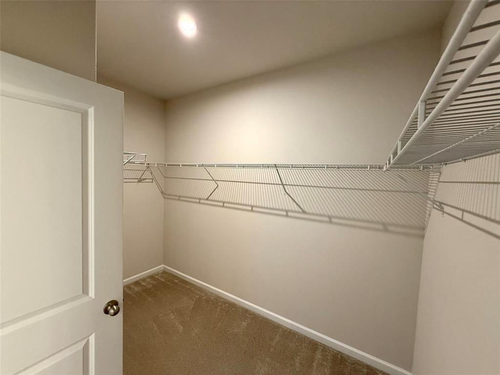 5576 Vigo Loop St. Cloud, FL 34771 - Photo 7 of 17 a view of a room with racks on the wall