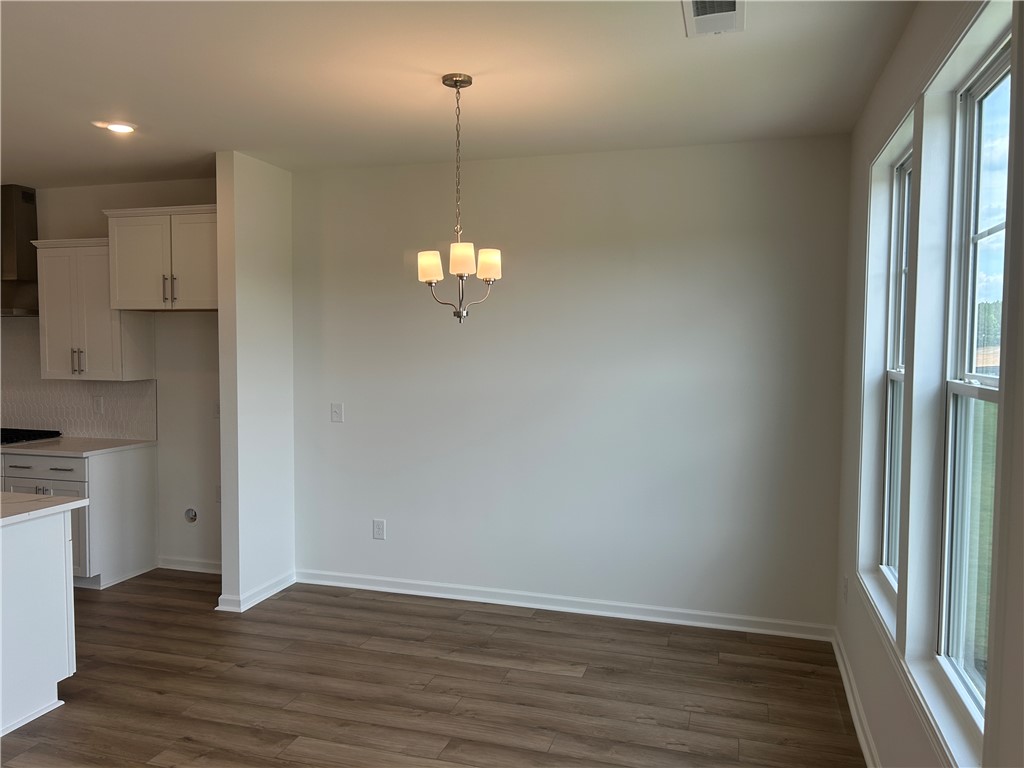 217 Bellflower Lane Anderson, SC 29625 - Photo 12 of 27 Natural light illuminates this versatile space, perfect for dining or an additional living area.