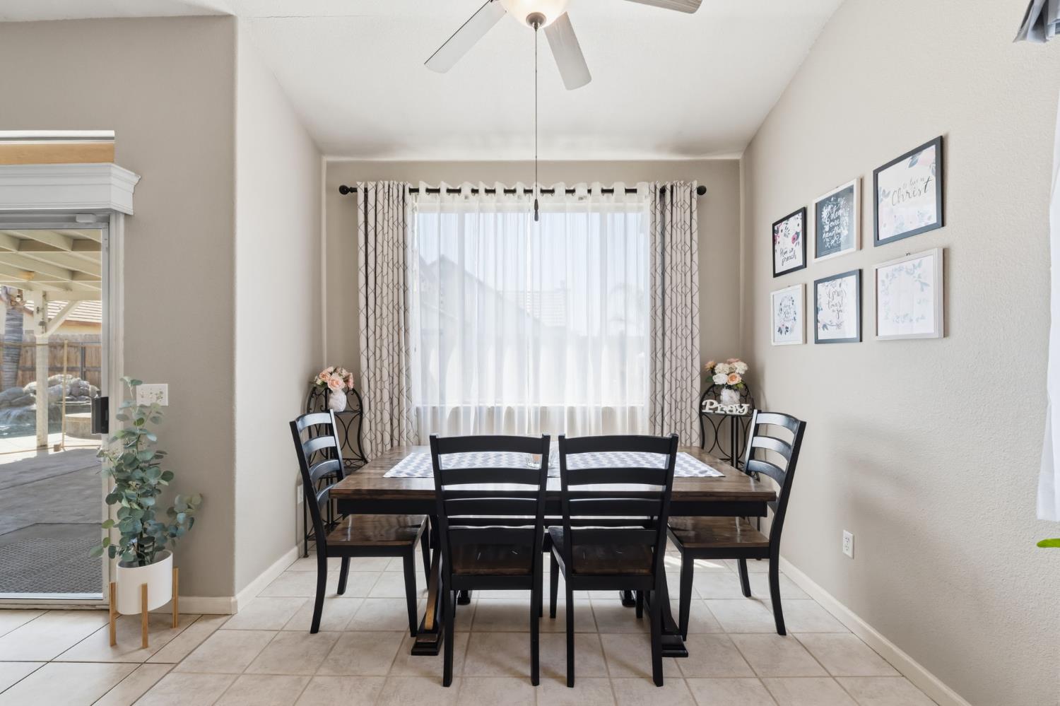 1757 Homestead Way Lemoore, CA 93245 - Photo 9 of 35 a dining room with furniture and window
