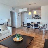 a view of a dining room with furniture and wooden floor