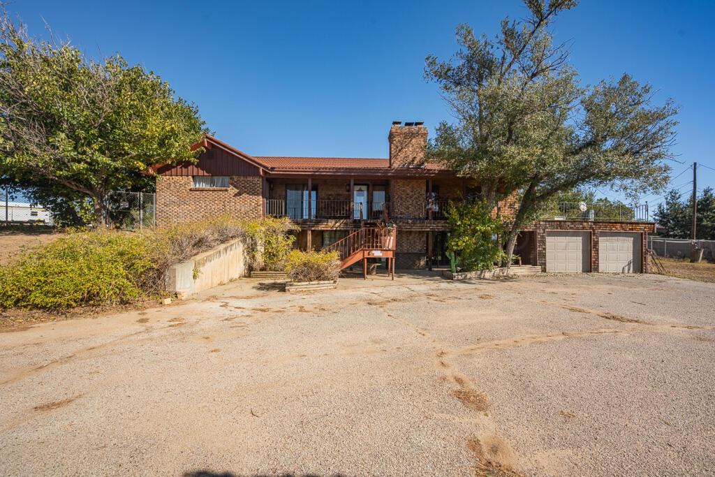 a view of a house with a snow on the road