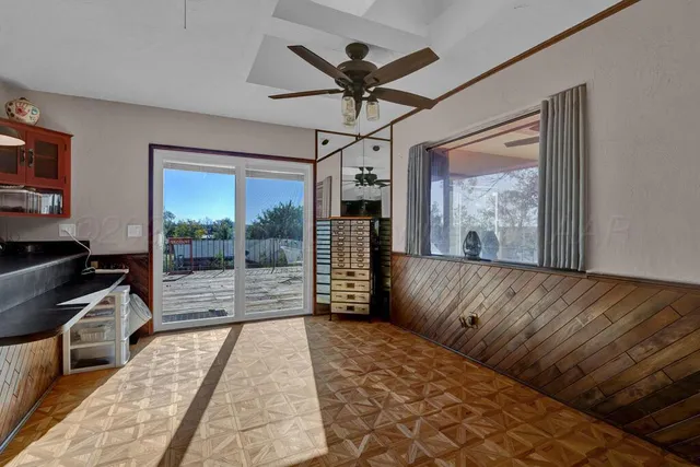 a view of a living room and a balcony