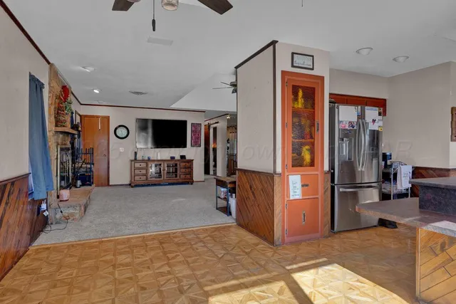 a view of a livingroom with walk in closet and bedroom