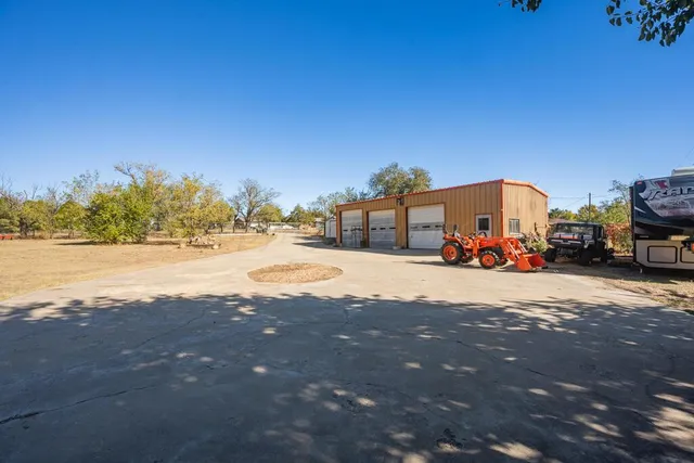 a view of the ocean with palm trees