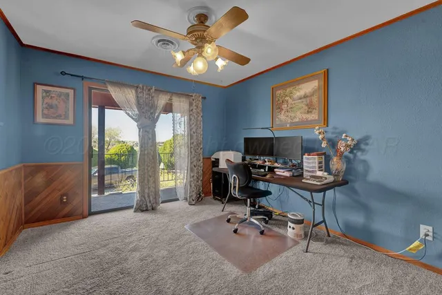 en suite bathroom with a bathtub and a chandelier