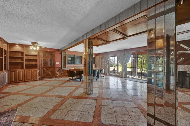 a view of a entryway with furniture and windows