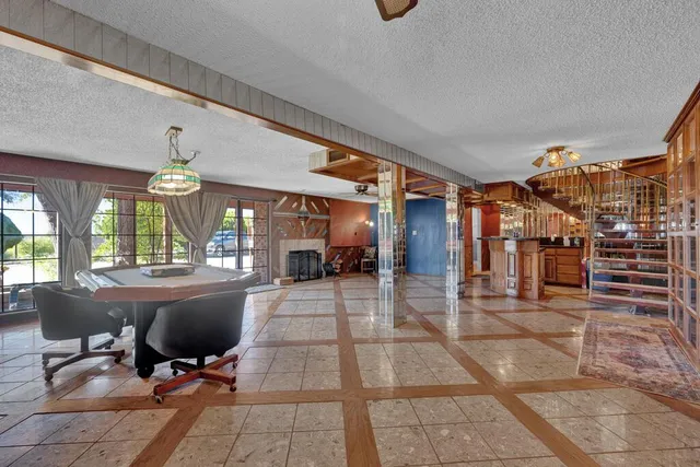 a dining room with table and chairs