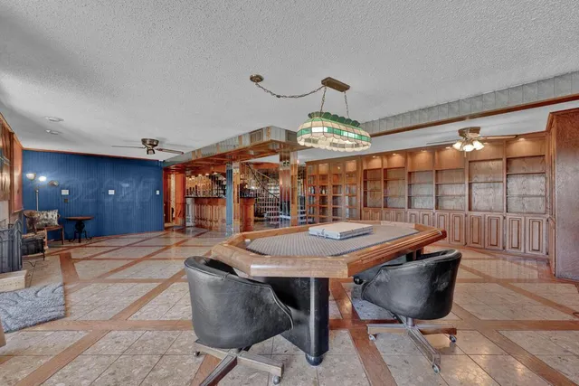 a view of a hall with sitting area