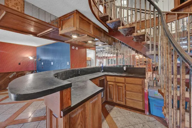 a bathroom with a shower and a sink