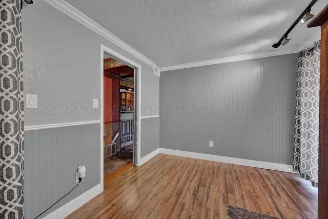 a view of a patio with chairs and wooden floor