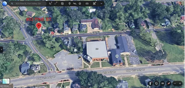 an aerial view of a house with outdoor space