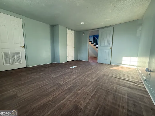 a view of a livingroom with wooden floor