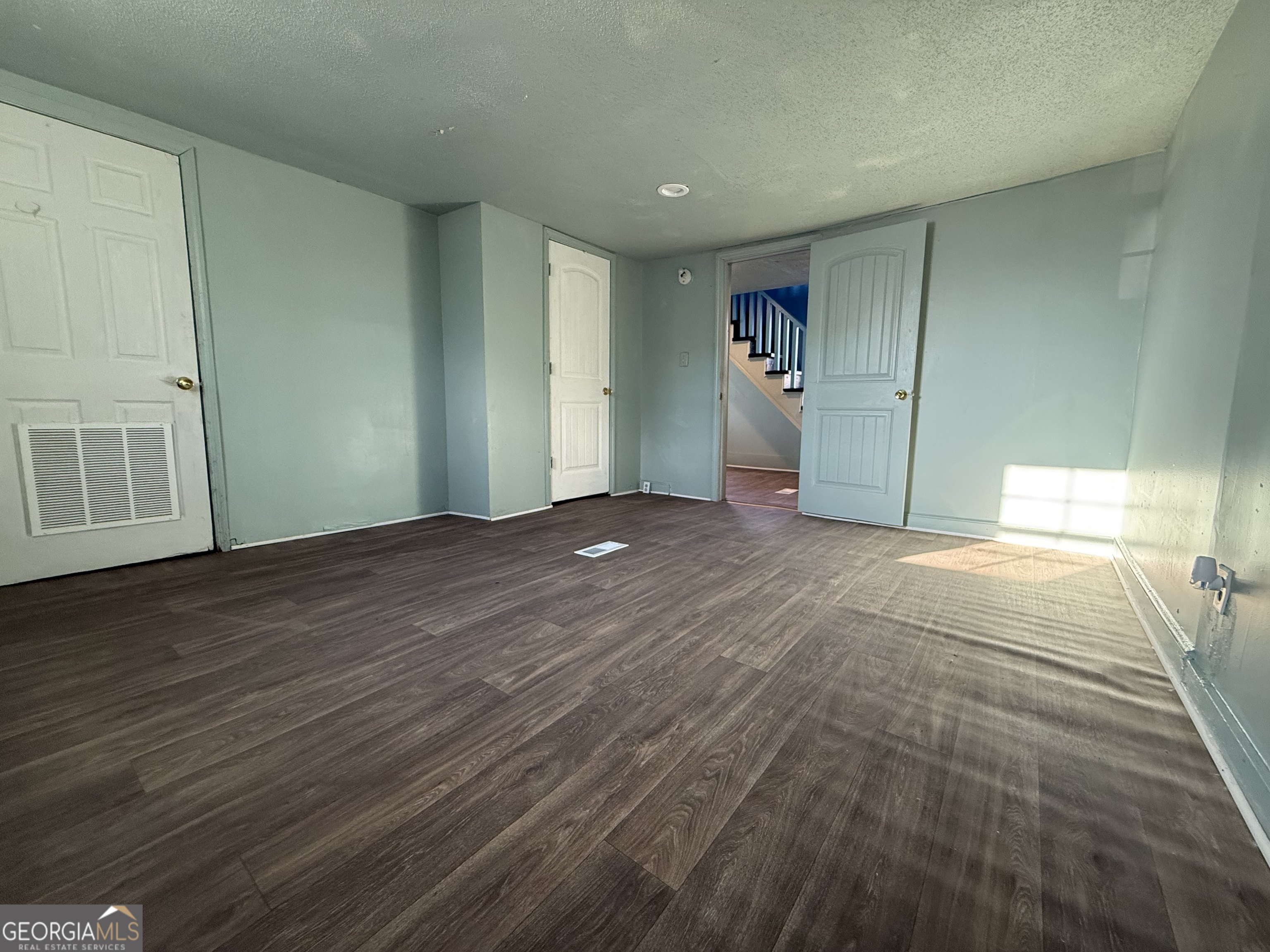803 Pine Street Fort Valley, GA 31030 - Photo 6 of 22 a view of a livingroom with wooden floor