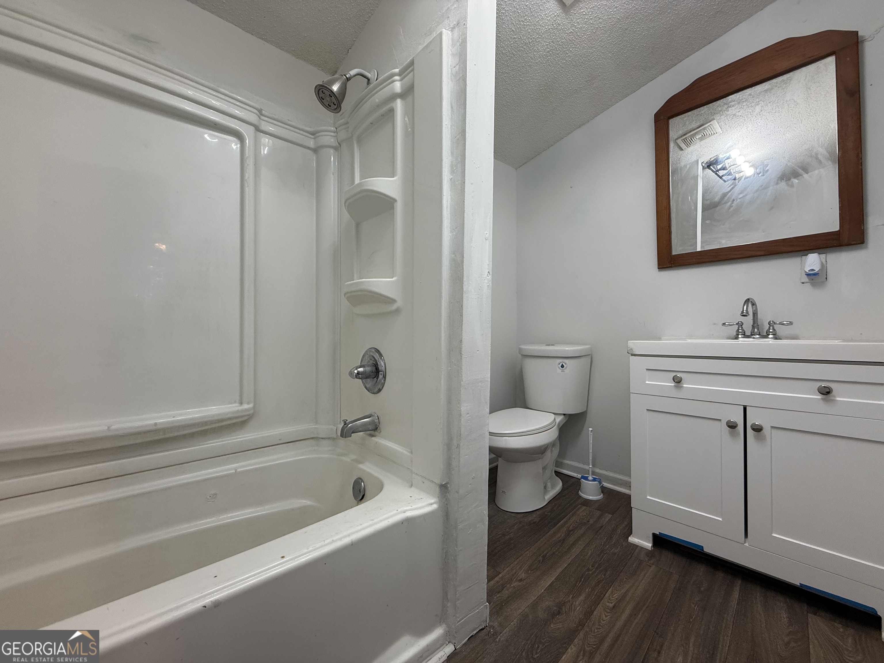 803 Pine Street Fort Valley, GA 31030 - Photo 9 of 22 a bathroom with a toilet a sink and a bathtub