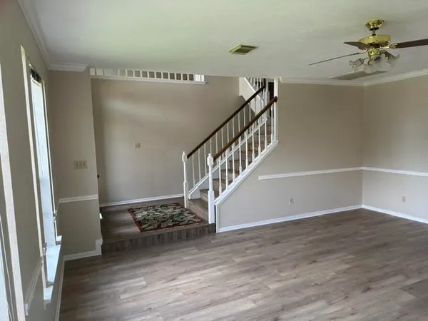 a view of entryway with wooden floor