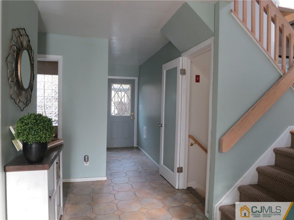6 Colburn Road East Brunswick, NJ 08816 - Photo 3 of 24 a view of entryway with window and hallway