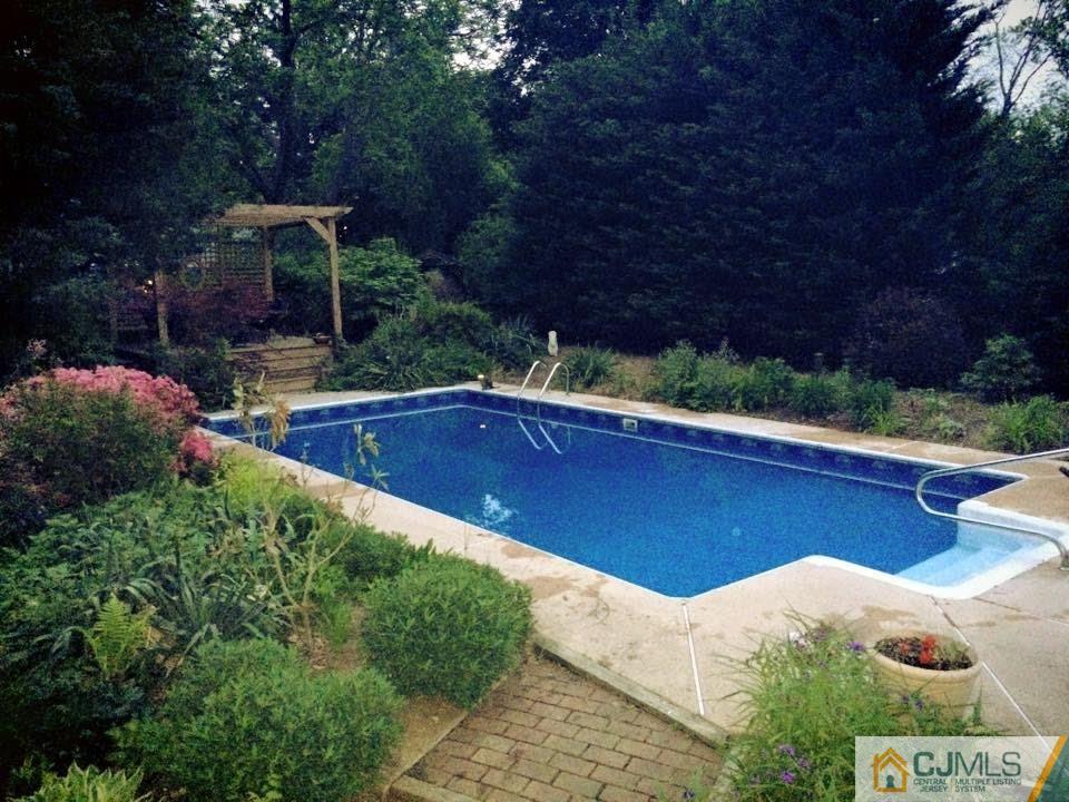 6 Colburn Road East Brunswick, NJ 08816 - Photo 23 of 24 a view of a backyard with plants and patio