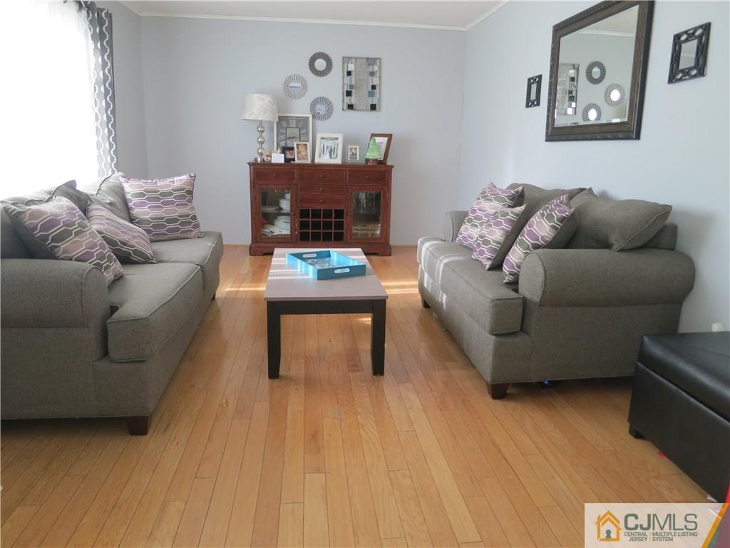 6 Colburn Road East Brunswick, NJ 08816 - Photo 8 of 24 a living room with furniture and a wooden floor