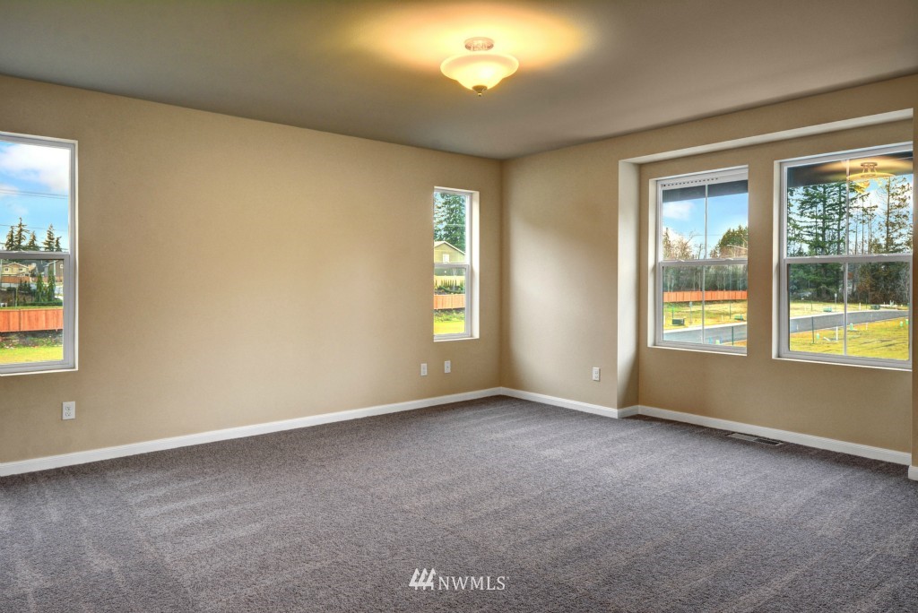 3601 176th Place Southeast, Unit 2009 Bothell, WA 98012 - Photo 12 of 19 an empty room with windows