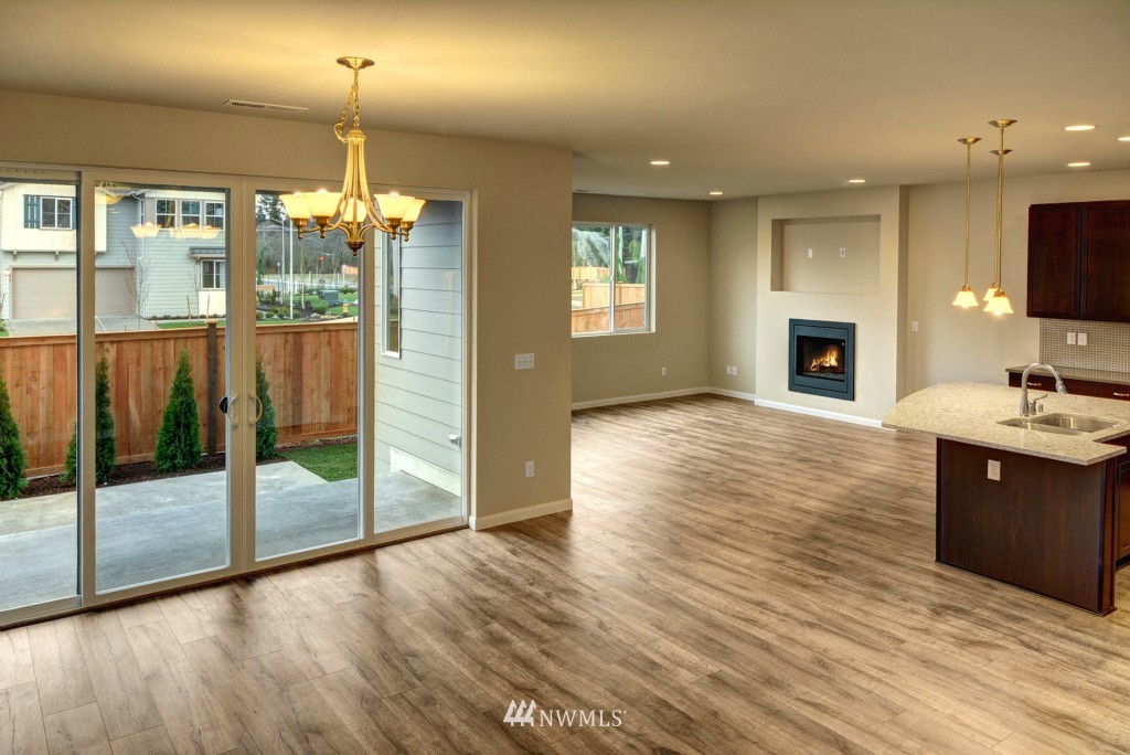 3601 176th Place Southeast, Unit 2009 Bothell, WA 98012 - Photo 7 of 19 a view of a living room kitchen and hardwood floor