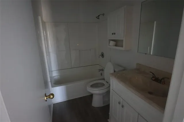 a bathroom with a sink and toilet