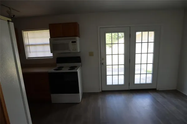 a kitchen with a stove and a microwave