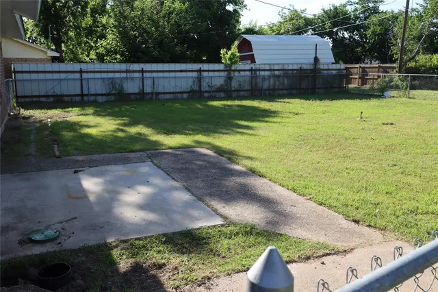 a view of a backyard with swimming pool