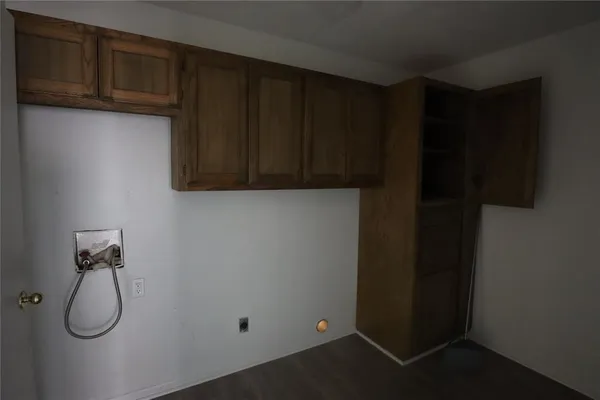 a bathroom with a cabinets and a window