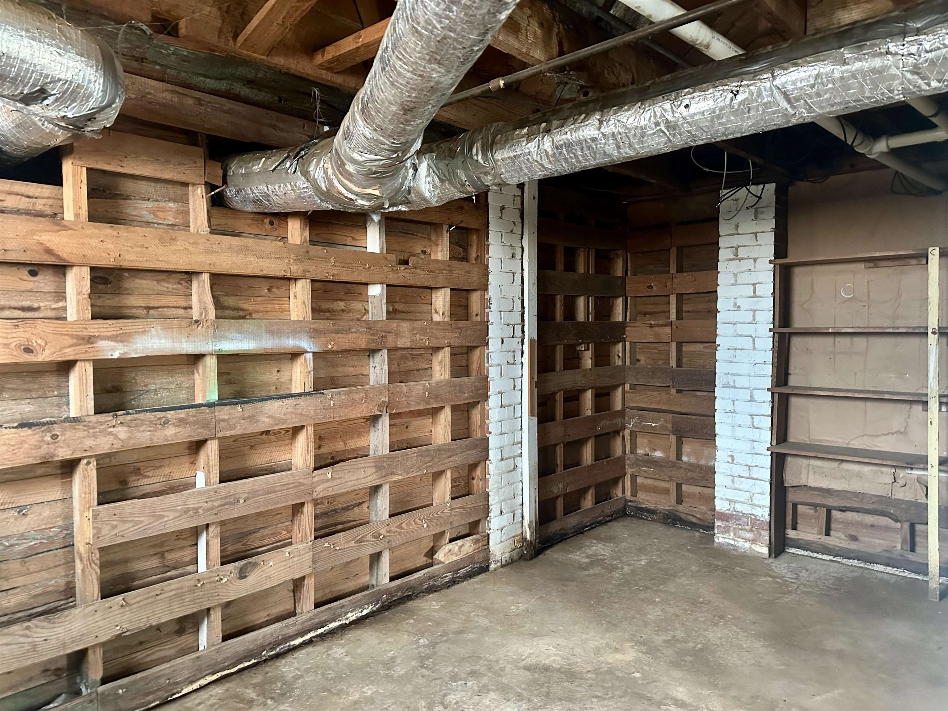 332 Pharr Avenue Selmer, TN 38375 - Photo 21 of 27 a view of an empty room with a brick wall
