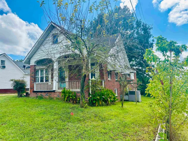 a view of a house with a garden