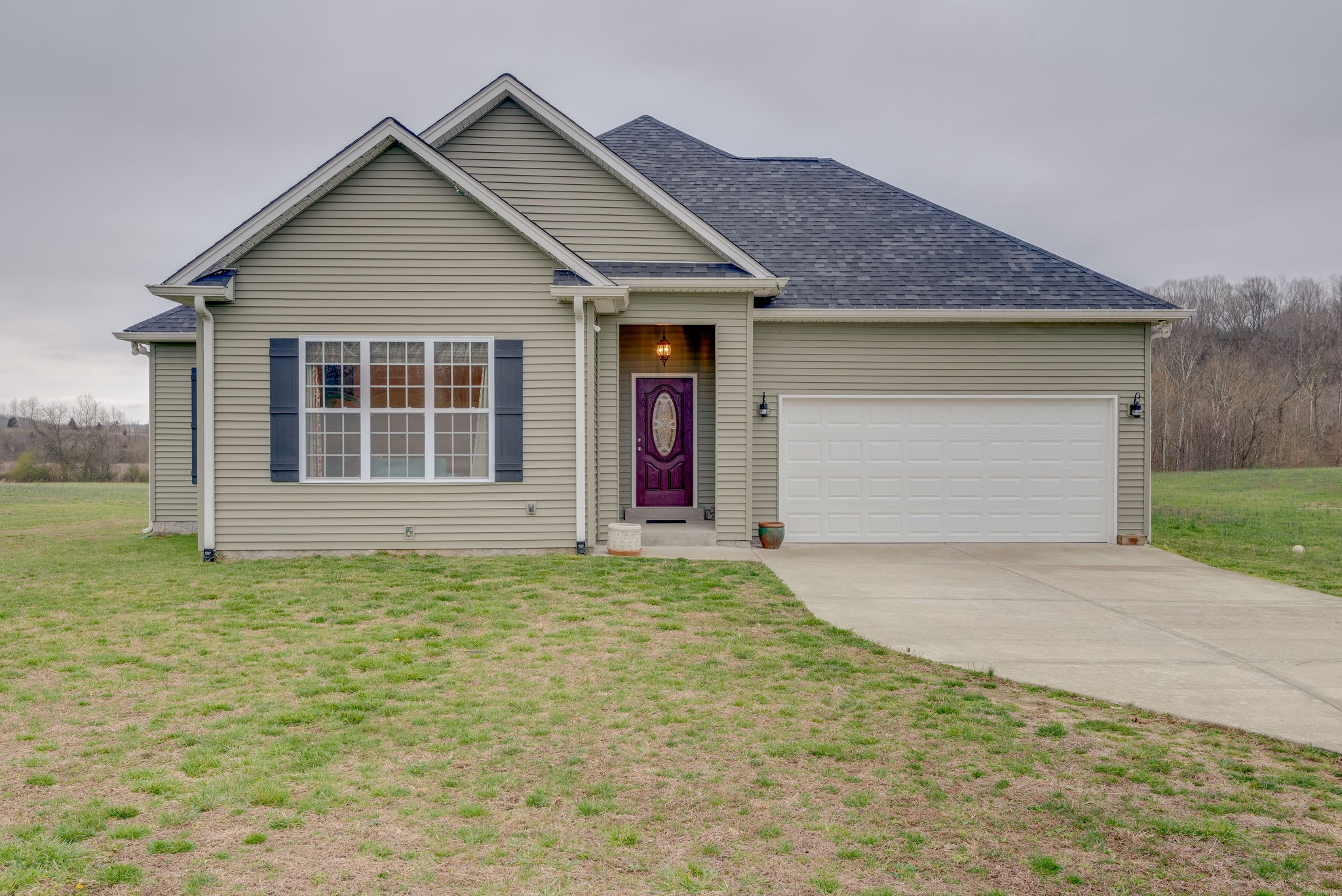 872 Tidwell Road Burns, TN 37029 - Photo 1 of 26 a view of an house with backyard and garden