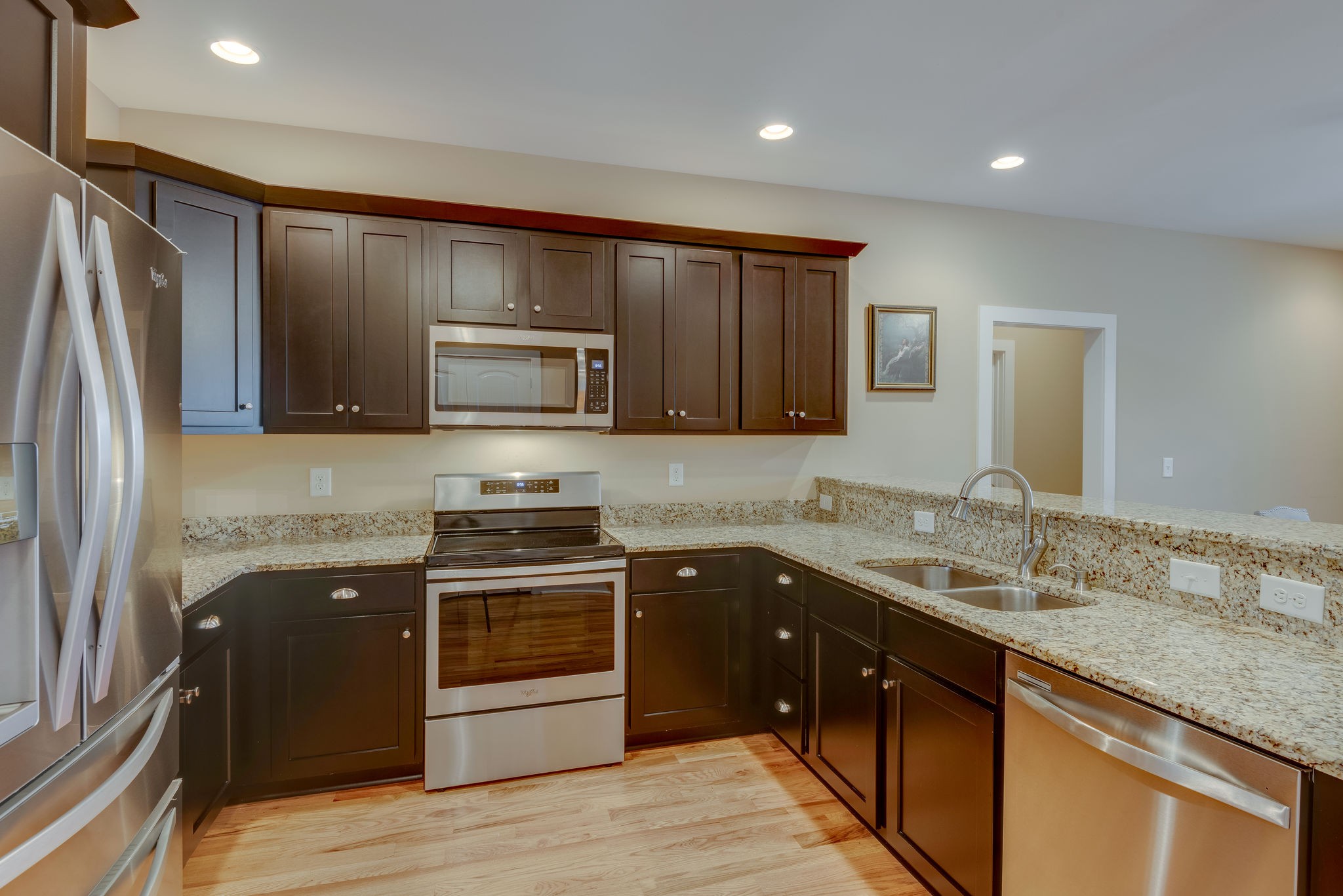 872 Tidwell Road Burns, TN 37029 - Photo 12 of 26 a kitchen with stainless steel appliances granite countertop a sink stove and refrigerator