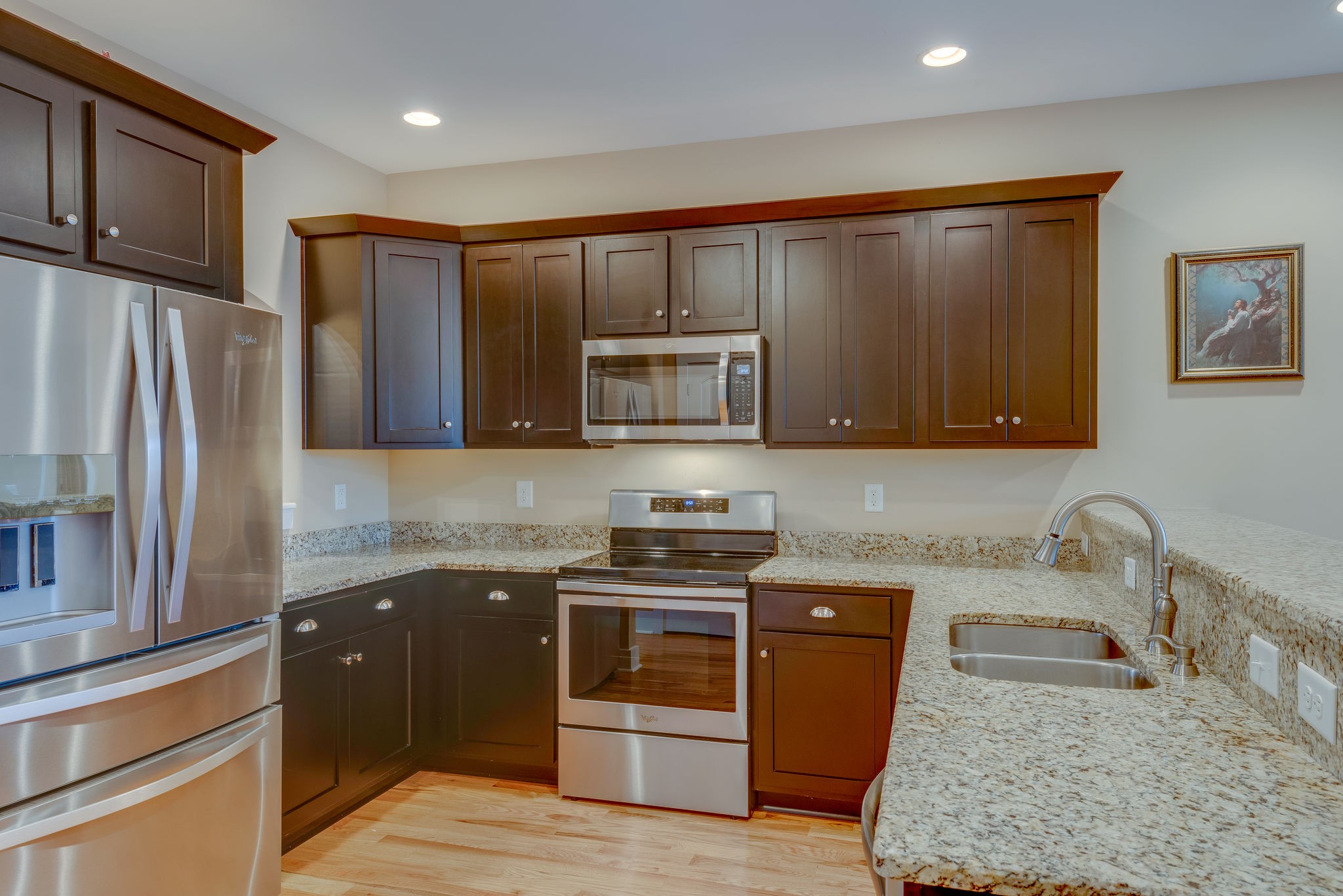 872 Tidwell Road Burns, TN 37029 - Photo 13 of 26 a kitchen with stainless steel appliances granite countertop a stove a sink and a microwave